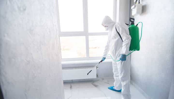 A certified mold inspector using specialized equipment to identify and locate mold growth in a residential property in Richmond